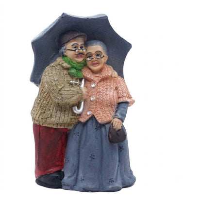 Elderly Couple with Umbrella Figurine