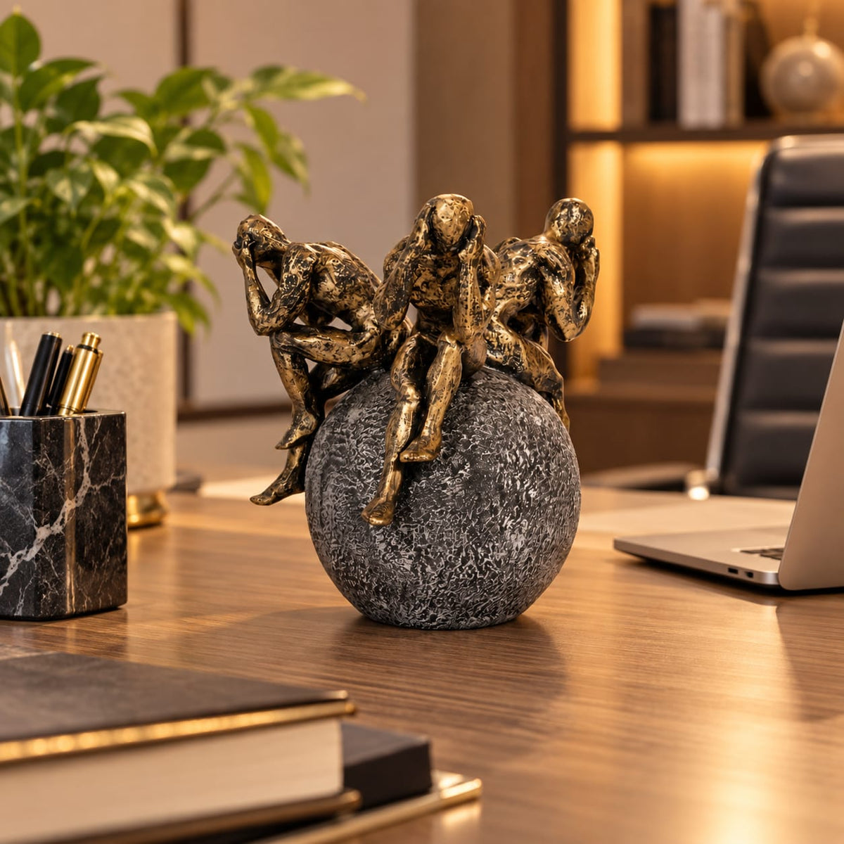 Thinking Figures on Globe Figurine